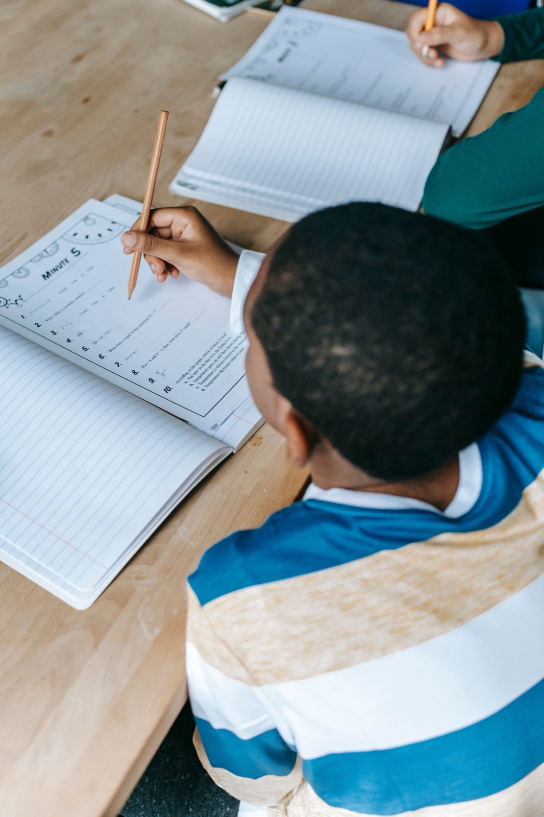 Parent helping child with schoolwork at home